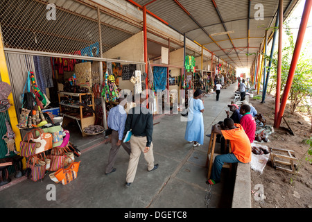 Street scene with local people, craft and curio shops, Livingstone town centre, Zambia Africa Stock Photo