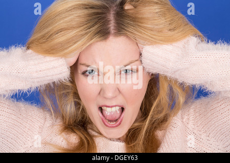 Model Released. Attractive Young Woman Screaming Stock Photo