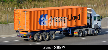 Hapag-Lloyd container loaded onto Maritime articulated trailer and hgv lorry truck M25 motorway road London orbital route Essex England UK Stock Photo