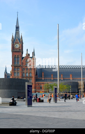 St Pancras International train station terminus historical clock tower seen from remodelled Kings Cross Square in London Borough of Camden England UK Stock Photo