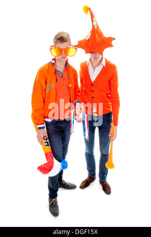 two disapointed fans of the dutch football team on a white background Stock Photo