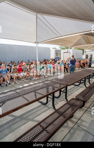 Mission Viejo, CA, middle school students listen to a lecture on correct cafeteria behavior on Pride Day. Stock Photo