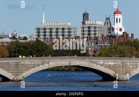 Cambridge, Massachusetts, USA, 20th Oct. 2013. Men's youth doubles teams row towards Harvard University, background, while competing in the Head of the Charles Regatta in Cambridge, Massachusetts, Sunday, Oct. 20, 2013. Stock Photo