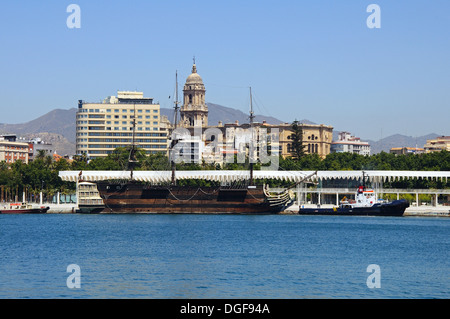 Replica of the Santisima Trinidad in the Inner harbour with the Cathedral (Catedral la Manquita) to the rear, Malaga, Spain. Stock Photo