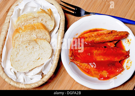 Tapas - Mackerel fillets in tomato sauce and olive oil with slices of bread, Andalusia, Spain, Western Europe. Stock Photo