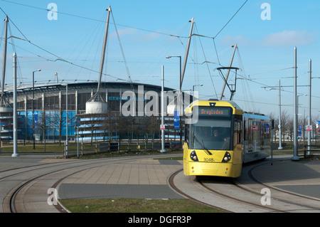 Metrolink tram near the Etihad Campus stadium, on the East Manchester Line, Eastlands, Manchester, England, UK Stock Photo