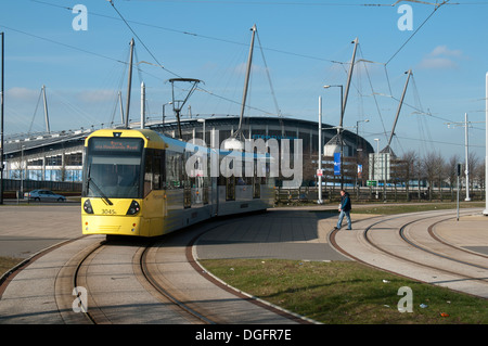 Metrolink tram near the Etihad Campus stadium, on the East Manchester Line, Eastlands, Manchester, England, UK Stock Photo