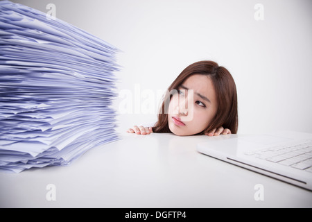 a business woman with a big pile of work Stock Photo