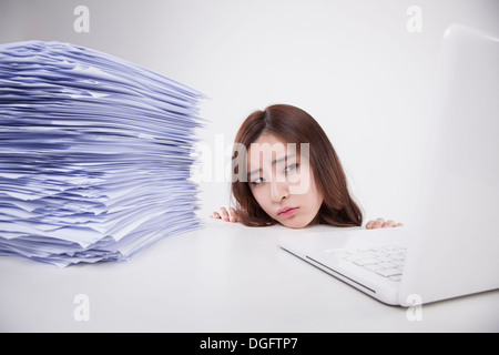 a business woman with a big pile of work Stock Photo