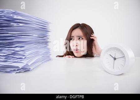 a business woman with a big pile of work Stock Photo