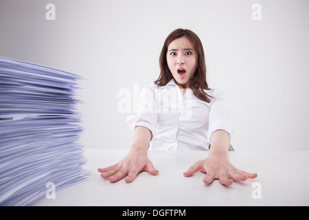 a business woman with a big pile of work Stock Photo