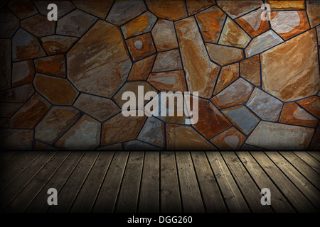 Old dark attic - stone wall and wooden floor. Stock Photo