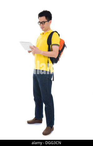 Young Asian student using pad PC isolated on white background. Stock Photo