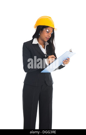 Isolated ethnic female architect holding and writing Stock Photo