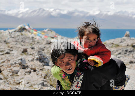 Tibetan pilgrims at Namtso Lake, Heavenly Lake, Tibet, China, Asia Stock Photo