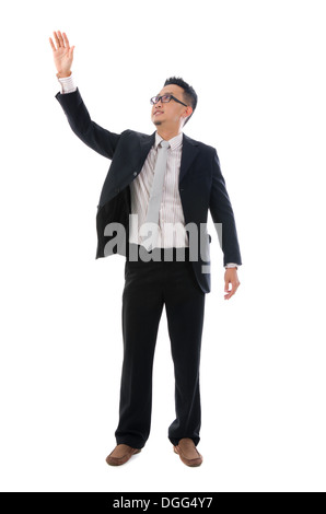 Business man touching an imaginary screen or button on white background Stock Photo