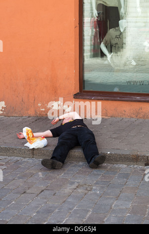 Tallinn. Estonia. Man passed out on the streets. Stock Photo