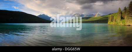 Clearing storm and rainbow over Bowman Lake in Glacier National Park, Montana Stock Photo