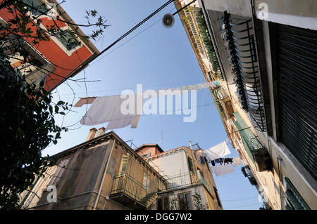 Laundry hanging on washing lines to dry between houses, Castello, Venice, Venezia, Veneto, Italy, Europe Stock Photo