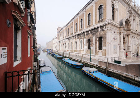 Boats on the canal of Rio dei Mendicanti, Scuola Grande di San Marco, Castello, Venice, Venezia, Veneto, Italy, Europe Stock Photo