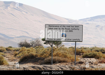 Sign from of the Roads Department in the dune landscape at Sossusvlei, Sossusvlei, Namib Desert, Namib Naukluft Park, Namibia Stock Photo