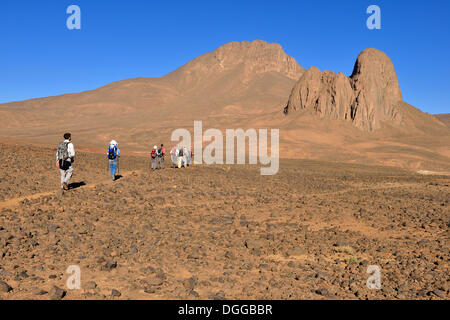 Group of hikers at the diatreme, volcanic pipe of Tahat mountain, Hoggar Mountains, Atakor, Tamanrasset Province, Algeria Stock Photo