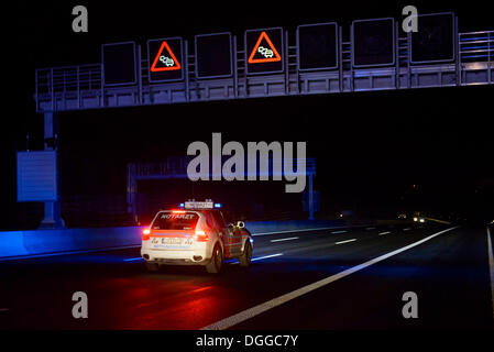 Notarzt, German for emergency physician, driving a Porsche Cayenne towards an accident scene on the A8 motorway near the Stock Photo
