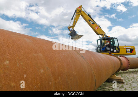 Drain pipe with a shovel excavator in the back, Dresden, Saxony Stock Photo