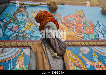 Physically disabled Sadhu, holy man, at one of the ghats of the historic city of Varanasi, India, Asia Stock Photo