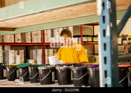 Man checking ink in screen print workshop Stock Photo