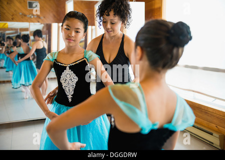 Mature woman teaching ballerinas Stock Photo