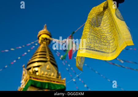 Yellow Buddhist prayer flag with Swayambhunath Stupa, Monkey Temple, Kathmandu Valley, Kathmandu, Kathmandu District Stock Photo