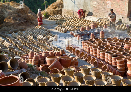 Workers sorting out pottery after the burning process, Kathmandu Valley, Thimi, Kathmandu District, Bagmati Zone, Nepal Stock Photo