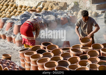 Workers sorting out pottery after the burning process, Kathmandu Valley, Thimi, Kathmandu District, Bagmati Zone, Nepal Stock Photo