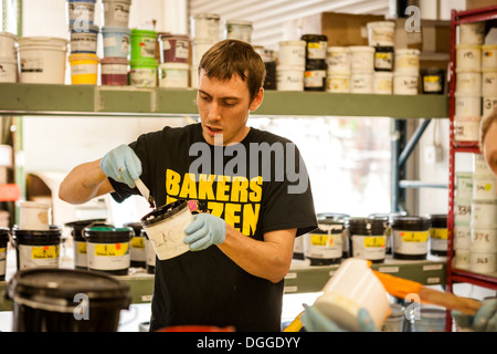 Worker mixing ink in screen print workshop Stock Photo