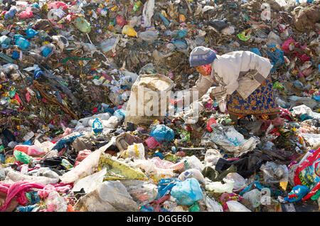Woman sorting out garbage at Aletar garbage dump, earning 300-400 nepali rupees a day, Aletar, Kathmandu District, Bagmati Zone Stock Photo