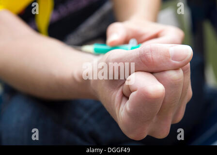 A syringe is being administered Stock Photo