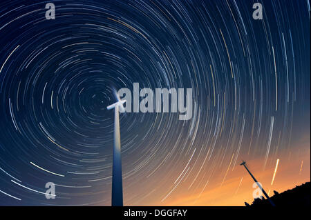 Wind turbines against a starry sky, Grevenbroich, North Rhine-Westphalia Stock Photo