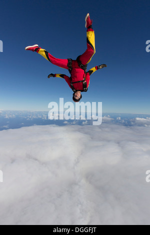 Female skydiver free falling upside down