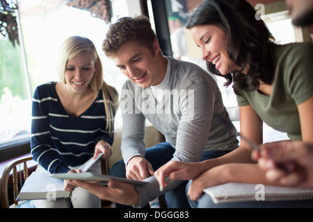 Group of people studying together in cafe Stock Photo