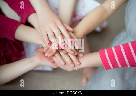 Girls putting hands together, close up Stock Photo
