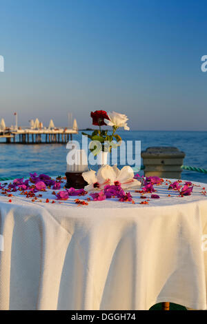 Table decorated with flowers on a jetty on the Turkish Riviera, Turkey, Asia Stock Photo