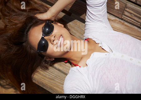 Young woman sunbathing, Palos Verdes, California, USA Stock Photo