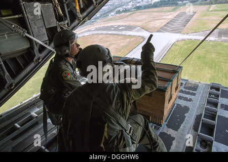 (From left to right) Airman 1st Class Andrew Fox and Tech. Sgt. Todd Bergin, loadmasters assigned to the 36th Airlift Squadron, Stock Photo