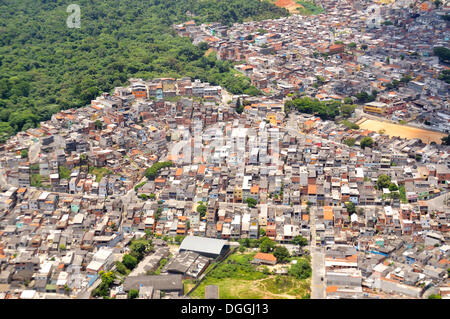 Aerial view of a Favela, slum area on the outskirts of Sao Paulo, town invading the rain forest, Sao Paulo, Brazil Stock Photo