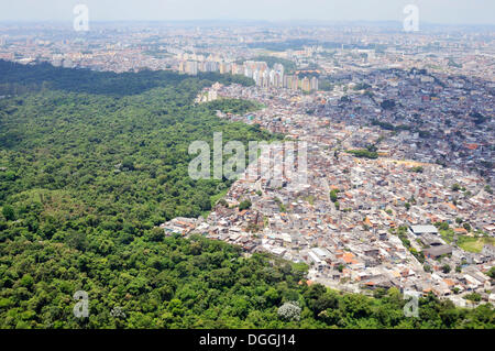 Aerial view of a Favela, slum area on the outskirts of Sao Paulo, town invading the rain forest, Sao Paulo, Brazil Stock Photo