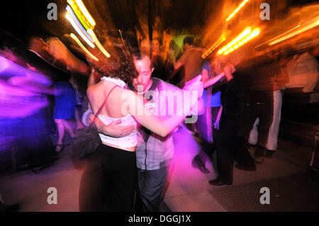 Dancing couples at a Milonga, tango event on the Plaza Dorrego square in the traditional San Telmo neighbourhood, Buenos Aires Stock Photo