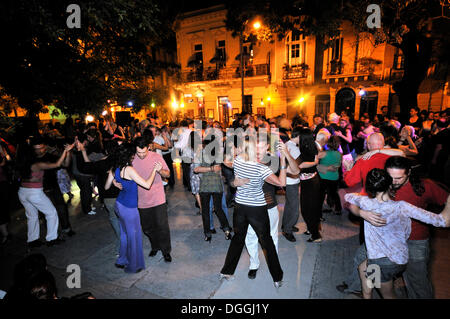 Dancing couples at a Milonga, tango event on the Plaza Dorrego square in the traditional San Telmo neighbourhood, Buenos Aires Stock Photo