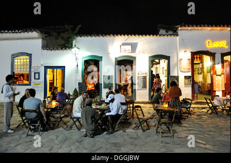 Tourists in a street restaurant at night, old town of Paraty or Parati, Costa Verde, State of Rio de Janeiro, Brazil Stock Photo