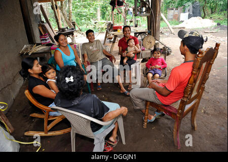 Large family sitting in the backyard chatting, La Sabanita, Masaya, Nicaragua, Central America Stock Photo